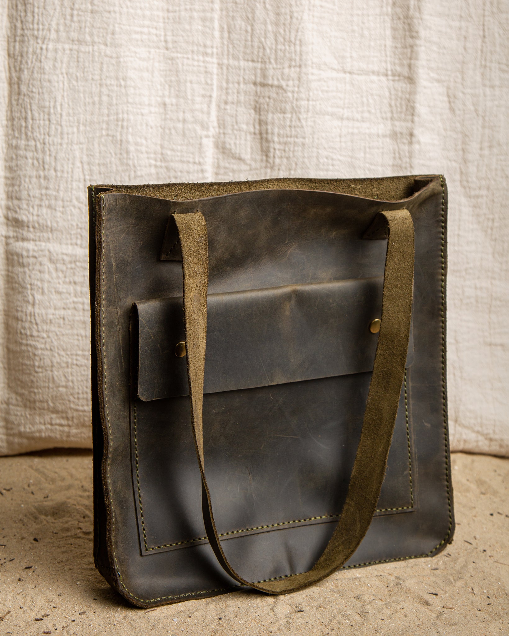 large brown leather tote bag